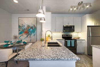 Undermount sinks with gooseneck faucets
